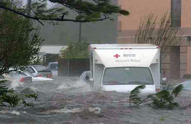 A Red Cross disaster relief truck is caught in the flood