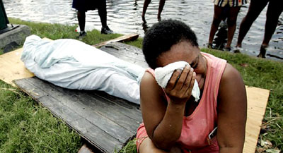 A woman grieves the loss of a family member