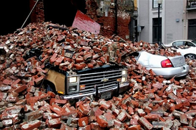 Cars crushed by bricks