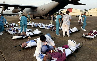 Injured and sick Hurricane Katrina survivors wait to be transported to a hospital