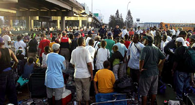 Hurricane Katrina survivors await evacuation